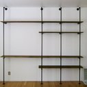 Build a shelving unit and desk out of pipes.