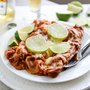 Spicy Beer Braised Lime Chicken Enchiladas | How Sweet It Is